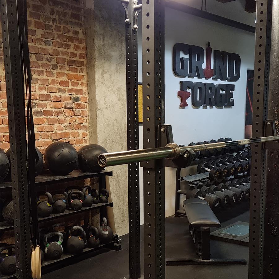 Combo rack and the GrindForge sign on the wall